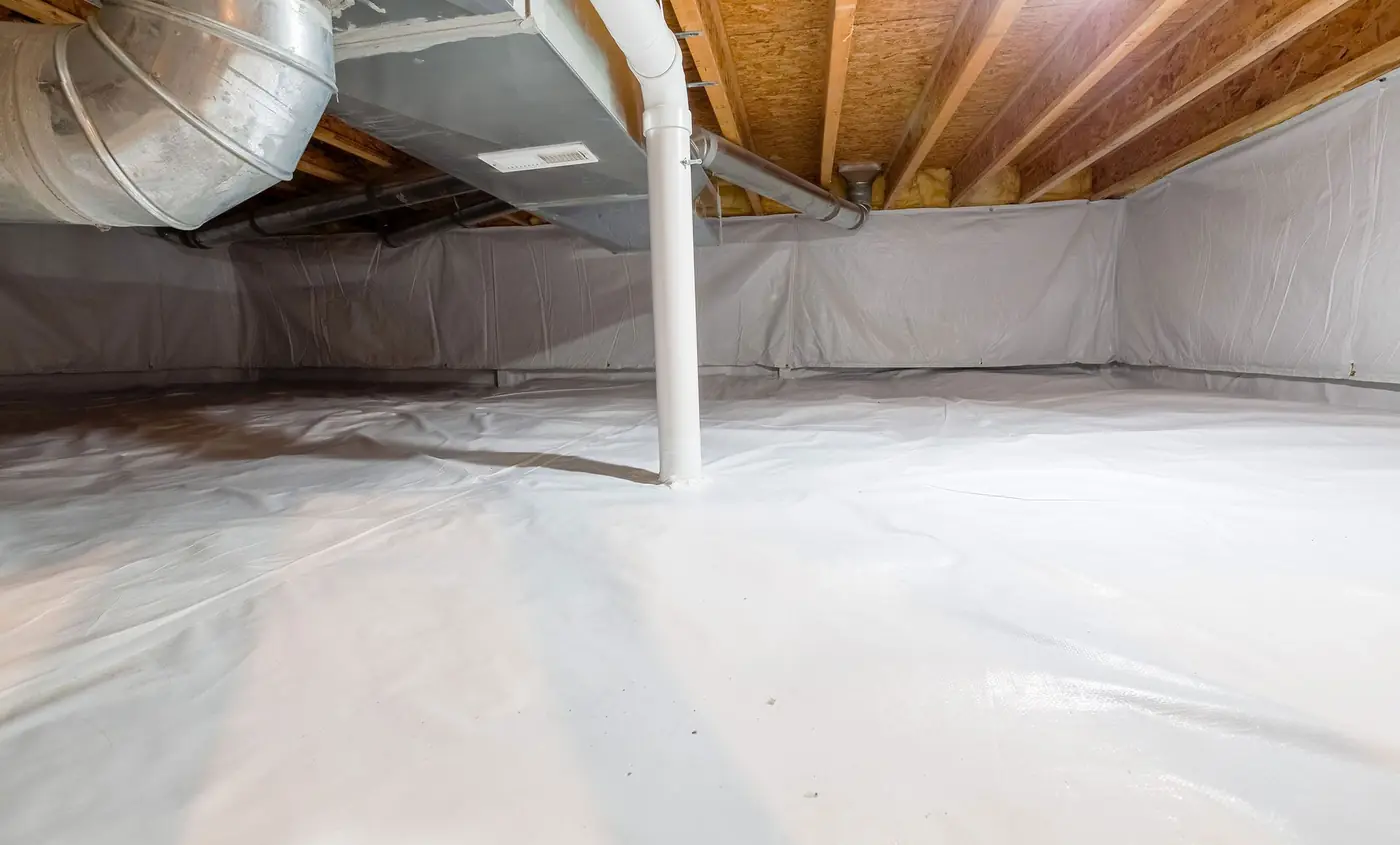 Encapsulated crawlspace with a white vapor barrier on the floor and walls